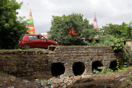 A man drives past the site where Mohammed Azam was killed in a mob lynching attack in Murki village in Bidar, India, July 19, 2018. REUTERS/Danish Siddiqui