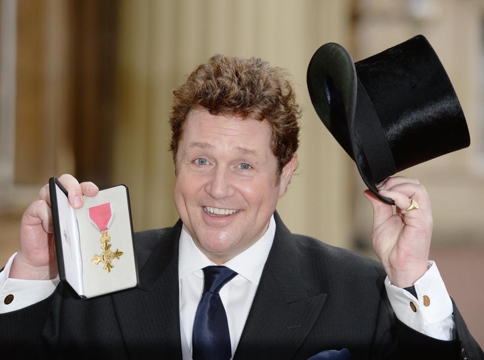 Michael Ball with his OBE after being presented with the honour by the then-Prince Charles at Buckingham Palace, 2016 (Getty Images)