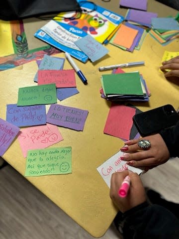 The children of Mighty Writers jot notes of encouragement in Spanish to migrant children at an El Paso shelter.