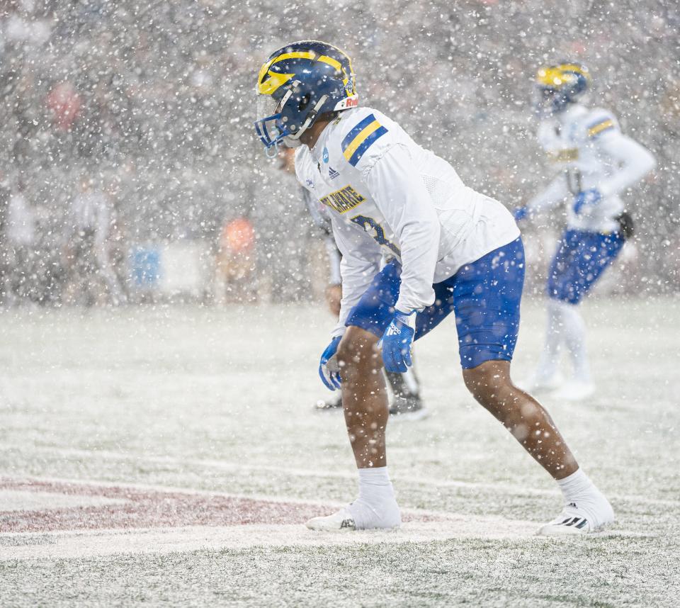 Delaware defensive back Alex Villas prepares for a play in the snow at Washington-Grizzly Stadium in Missoula, Montana, Saturday night.