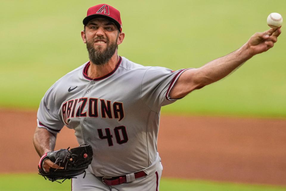 Jul 29, 2022; Cumberland, Georgia, USA; Arizona Diamondbacks starting pitcher Madison Bumgarner (40) pitches against the Atlanta Braves during the first inning at Truist Park.