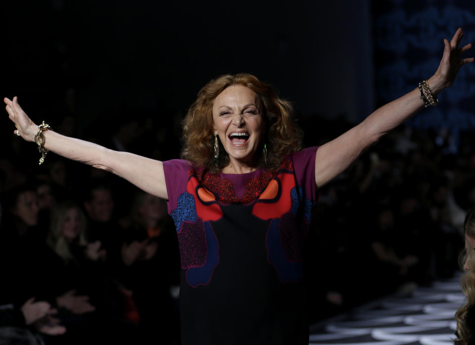 Designer Diane von Furstenberg greets the crown after her Fall 2014 collection is modeled during Fashion Week in New York, Sunday, Feb. 9, 2014. (AP Photo/Seth Wenig)