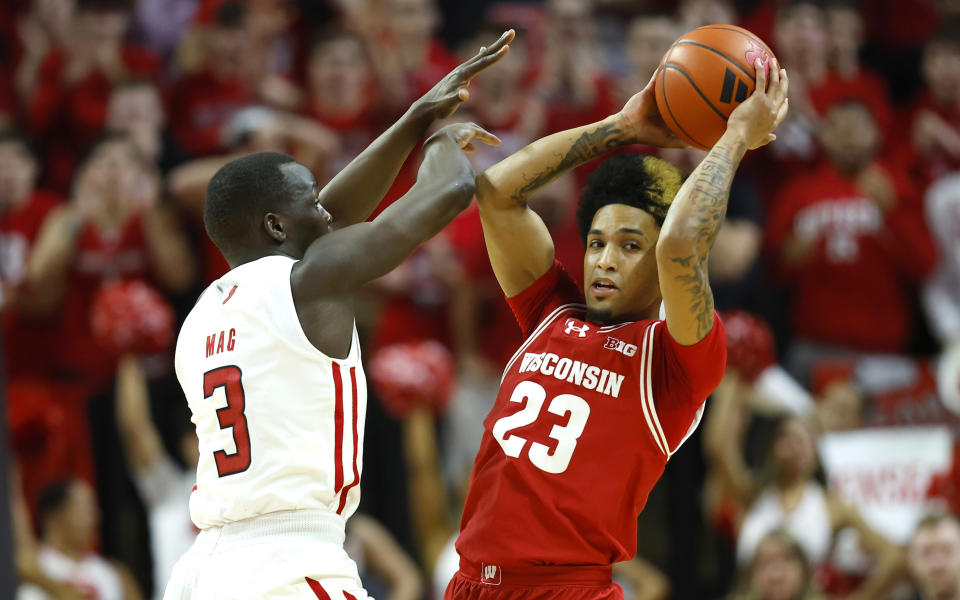 Rutgers forward Mawot Mag (3) defends against Wisconsin guard Chucky Hepburn (23) during the first half of an NCAA college basketball game, Saturday, Feb. 10, 2024, in Piscataway, N.J. (AP Photo/Noah K. Murray)