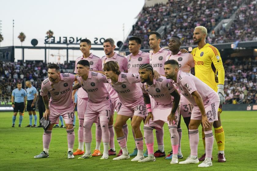 Inter Miami stands for a team photo before an MLS soccer match against Los Angeles FC, Sunday, Sept. 3, 2023, in Los Angeles. (AP Photo/Ryan Sun)