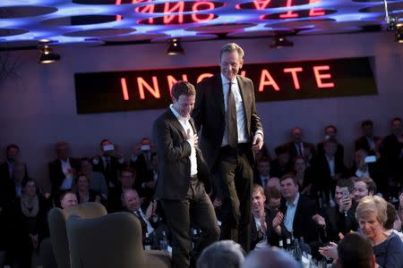 Facebook founder and CEO Mark Zuckerberg (L) stands with Mathias Doepfner, CEO of Axel Springer SE to receive the newly established Axel Springer Award during a ceremony in Berlin, Germany, February 25, 2016. REUTERS/Kay Nietfeld/Pool