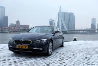 FILE PHOTO: A BMW hybrid car stands near Rotterdam's Erasmus bridge