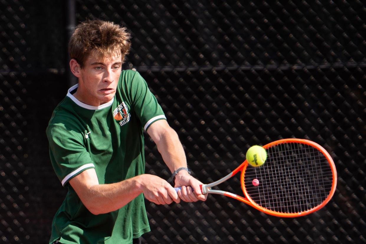 Hopkinton High 1st singles player Lex Kaye returns a shot from Duxbury sophomore Tim Vargas, during the Division 2 state semifinal at Lexington High, June 15, 2023.