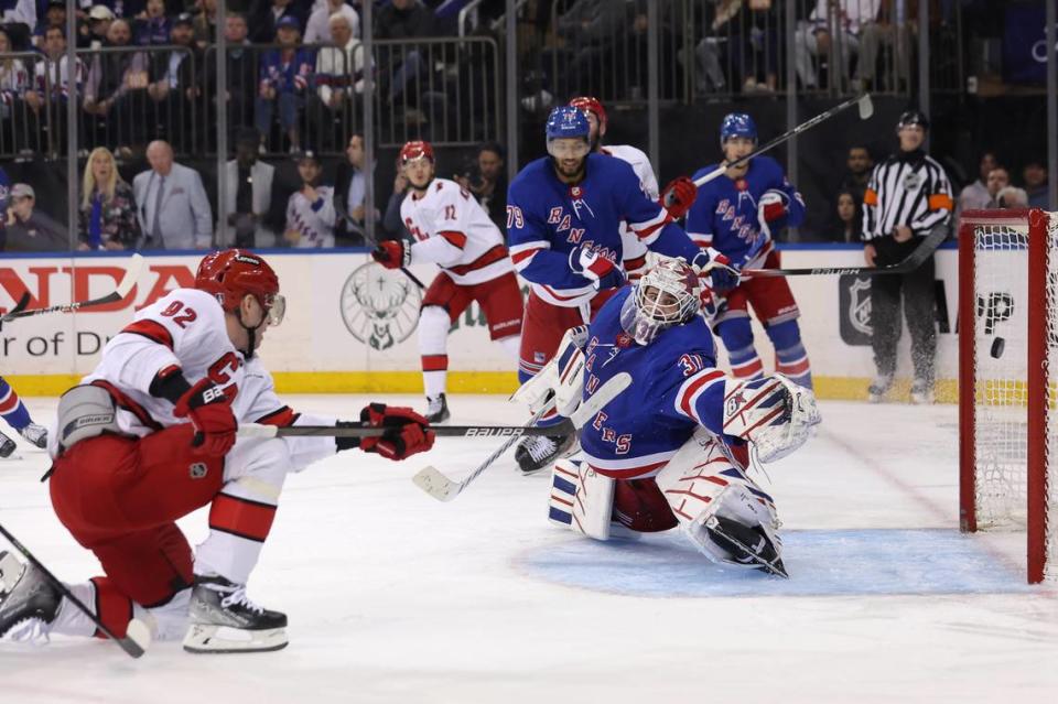 May 13, 2024; New York, New York, USA; Carolina Hurricanes center Evgeny Kuznetsov (92) scores a goal against New York Rangers goaltender Igor Shesterkin (31) during the third period of game five of the second round of the 2024 Stanley Cup Playoffs at Madison Square Garden. Mandatory Credit: Brad Penner-USA TODAY Sports