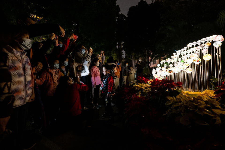 People take photos in Guangzhou Cultural Park during the Lantern Festival, Feb. 5, 2023.