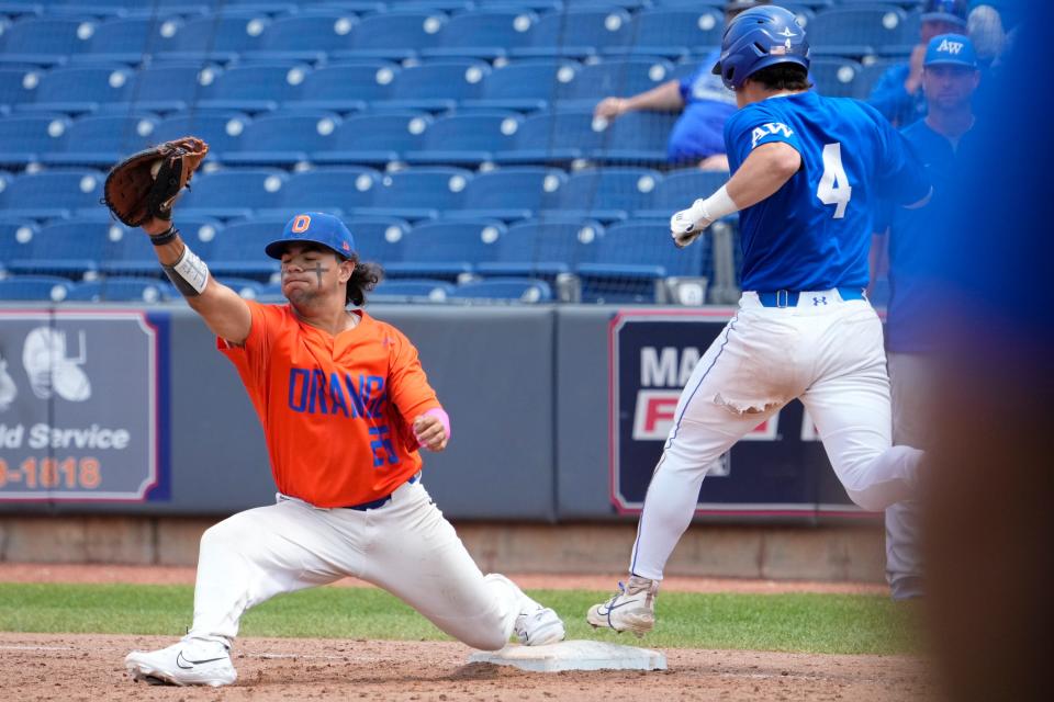 Olentangy Orange's Diego Astacio stretches for a throw at first base, recording an out against Anthony Wayne during a Division I state semifinal Thursday.