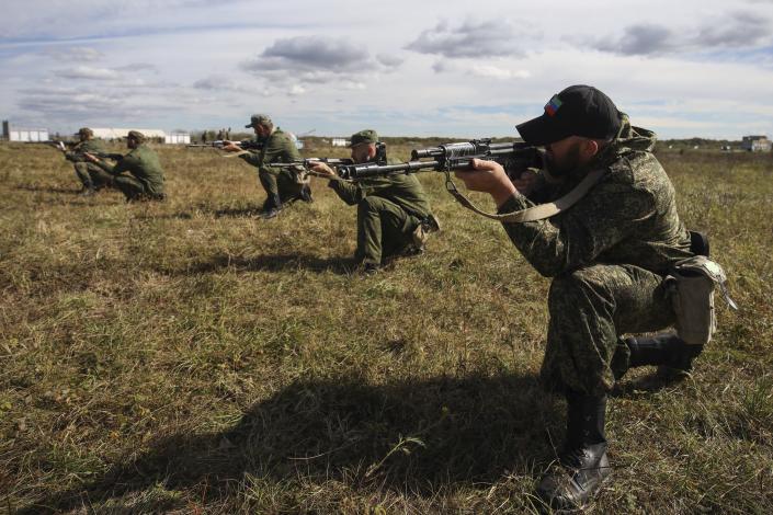 Recruits attend military training at a firing range in the Krasnodar region in southern Russia, Tuesday, Oct. 4, 2022. Russian Defense Minister Sergei said that the military has recruited over 200,000 reservists as part of a partial mobilization launched two weeks ago. (AP Photo)