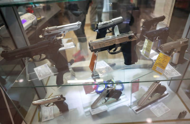 Gas pistols are displayed at a Hungarian gun shop where people queued up to buy weapons for protection amid the spread of coronavirus, in Budapest
