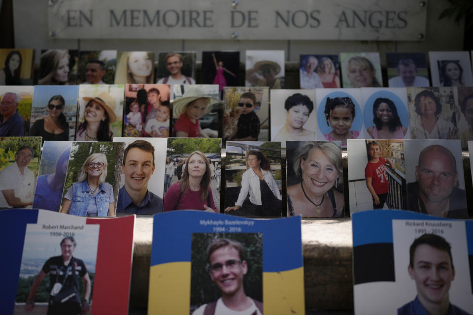 "In Memory of our Angels" is engraved on the on the memorial of the victims of the attack of July 14, 2016 with pictures of the victims along Nice's Promenade des Anglais, to commemorate the 2016 terror attack, in Nice, South of France, Sunday, Sept. 4, 2022. Eight suspects will face trial in a Paris Court on Monday, in connection with the 2016 Bastille Day truck attack in Nice that left 86 people dead. (AP Photo/Daniel Cole)