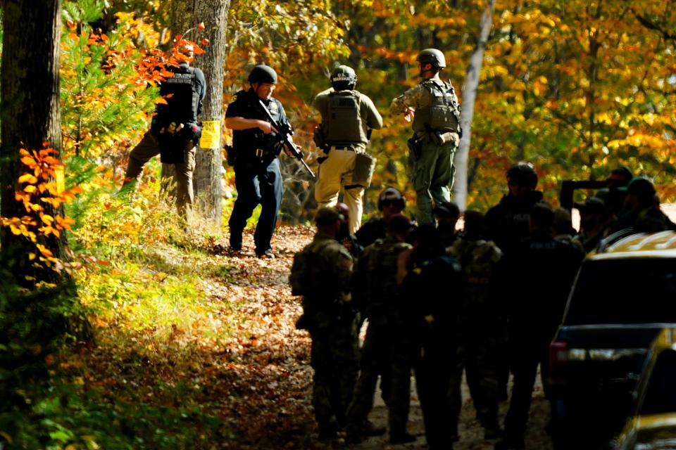 Law enforcement continue a manhunt in the aftermath of a mass shooting, in Durham, Maine, Friday, Oct. 27, 2023..Authorities are scouring hundreds of acres of family-owned property, sending dive teams to the bottom of a river and scrutinizing a possible suicide note in the second day of their intensive search for an Army reservist accused of fatally shooting several people in Maine.