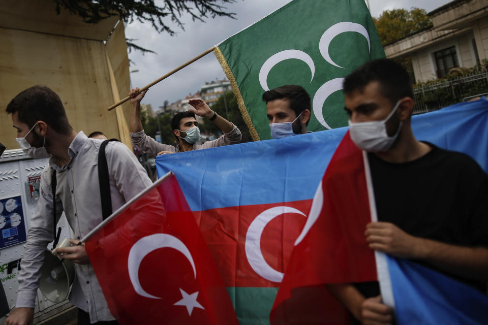 Youths from the Turkey Youth Foundation organisation chant slogans during a protest supporting Azerbaijan in front of Azerbaijan's consulate in Istanbul, Tuesday, Sept. 29, 2020. Armenian and Azerbaijani forces accused each other of attacks on their territory Tuesday, as fighting over the separatist region of Nagorno-Karabakh continued for a third straight day following the reigniting of a decades-old conflict.(AP Photo/Emrah Gurel)