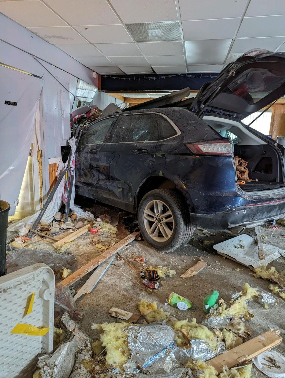 A photo taken of the vehicle after it crashed through the Swan Boat Club building during a child's birthday party in Newport on Saturday, April 20, 2024.