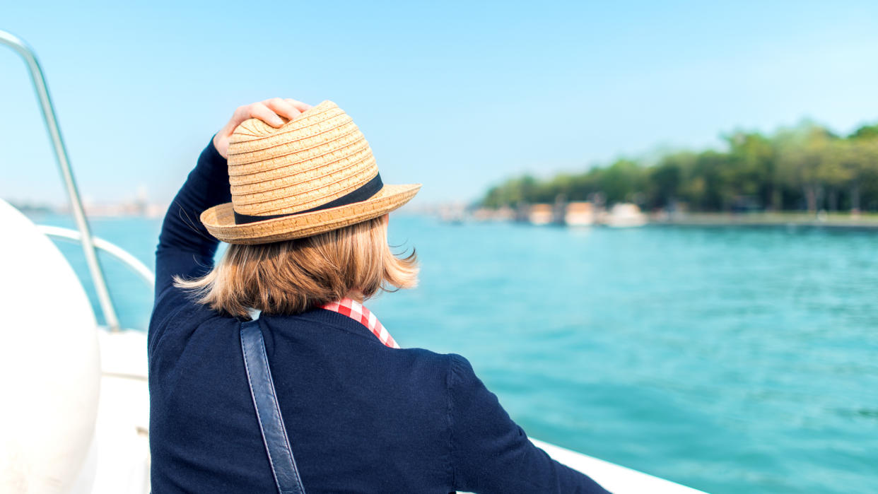 A tourist on a deck of a cruise ship.