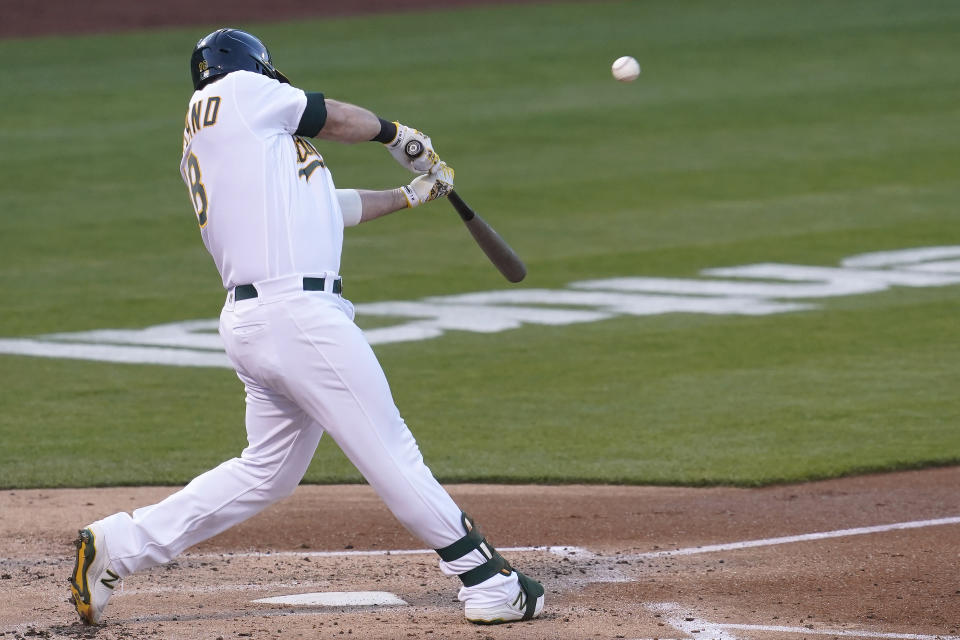 Oakland Athletics' Mitch Moreland hits a two-run home run against the Toronto Blue Jays during the second inning of a baseball game in Oakland, Calif., Tuesday, May 4, 2021. (AP Photo/Jeff Chiu)