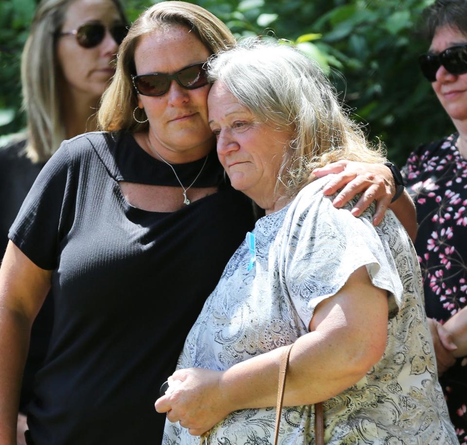 Curtis Cole's sister Shannon Cole (Hawkins) comforts their mom Mary Jewell during his funeral service at Cold Springs Cemetery in East Rochester Sunday, June 12, 2022.