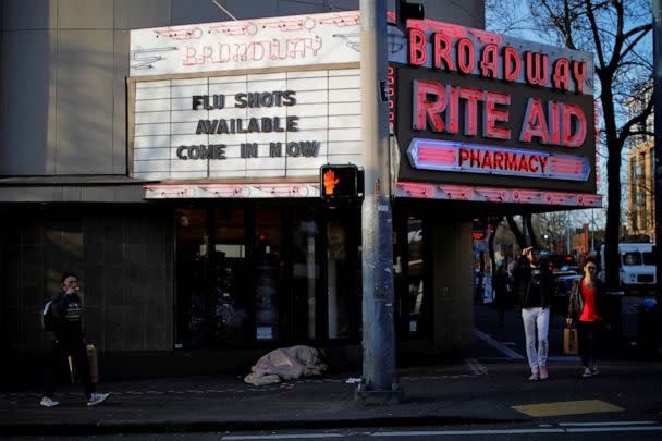 PHOTO: FILE PHOTO: The sign over a drug store advertises flu shots amid the coronavirus (COVID-19) outbreak in Seattle, March 17, 2020. (Brian Snyder/Reuters, FILE)