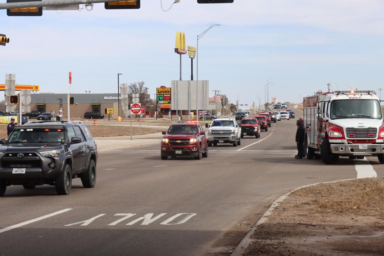 The body of Fritch Volunteer Fire Department Chief Zeb Smith is escorted through Amarillo Tuesday, as the convoy makes its way from Borger to Lubbock. Smith suffered a medical emergency and died while fighting a fire Tuesday, officials confirmed.