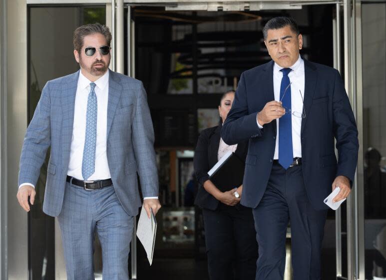 BEVERLY HILLS, CA - October 17: LAPD assistant chief Al Labrada, right, held a news conference with his lawyer Jeremy Tissot regarding allegations of him stalking a lower-ranking officer he was romantically involved with. Photographed at Tissot Law Firm on Tuesday, Oct. 17, 2023 in Beverly Hills, CA. (Myung J. Chun / Los Angeles Times)