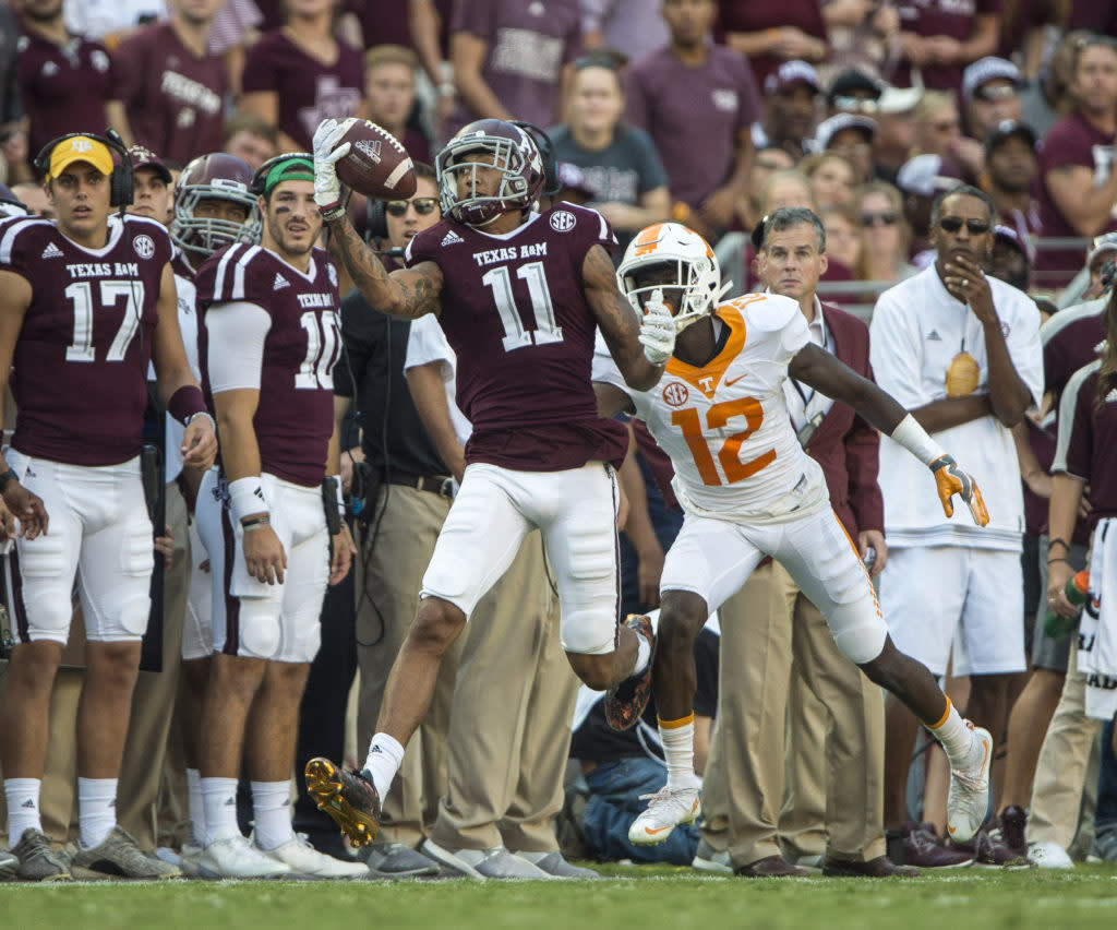 Oct 8, 2016; College Station, TX, USA; Texas A&M Aggies wide receiver Josh Reynolds (11) makes a one handed catch as Tennessee Volunteers defensive back Emmanuel Moseley (12) defends during the second half at Kyle Field. The Aggies defeated the Volunteers 45-38 in overtime. Mandatory Credit: Jerome Miron-USA TODAY Sports