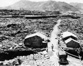 FILE - This Sept. 14, 1945, file photo shows shacks made from scraps of debris from buildings that were leveled in the aftermath of the atomic bomb that was dropped over Nagasaki. The city of Nagasaki in southern Japan marks the 75th anniversary of the U.S. atomic bombing of Aug. 9, 1945. It was a second nuclear bomb dropped by the U.S. three days after it made the world’s first atomic attack on Hiroshima. (AP Photo, File)