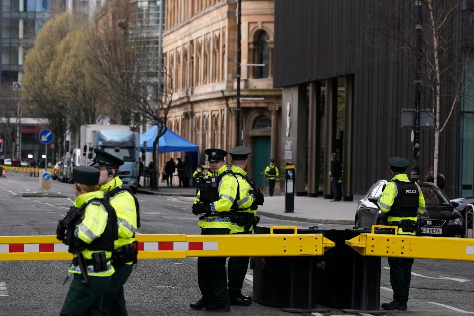 Police stand guard outside the hotel where President Joe Biden will stay in Belfast, Northern Ireland, Tuesday, April 11, 2023. President Biden is visiting Northern Ireland and Ireland to celebrate the 25th Anniversary of the Good Friday Agreement. (AP Photo/Christophe Ena)