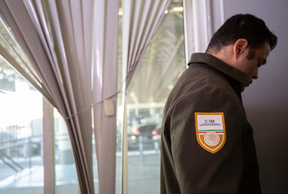 A Mexican immigration official accompanies Francisco Garduño, Mexico’s top immigration official, during a visit to the Zaragoza international bridge in Ciudad Juárez on Tuesday, May 16, 2023, as part of a tour with members of the media of the installations that will be accommodated to “shelter” migrants that are expelled from the U.S.