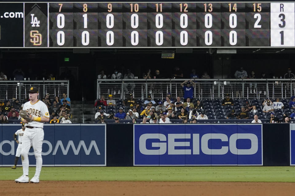 The San Diego Padres play the Los Angeles Dodgers during the fifteenth inning of a baseball game Thursday, Aug. 26, 2021, in San Diego. (AP Photo/Gregory Bull)