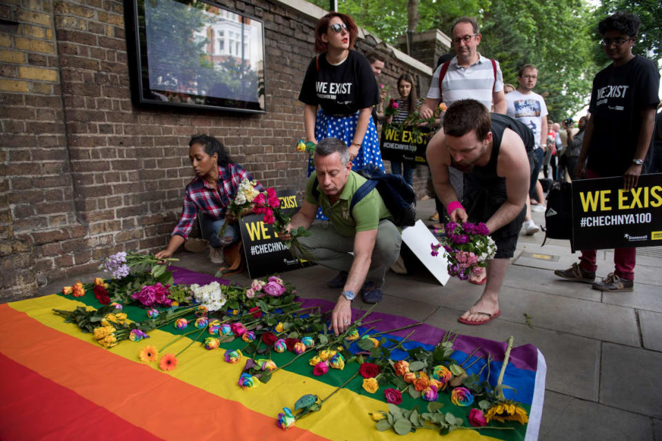 <div class="inline-image__caption"><p>Demonstrators lay roses on a rainbow flag as they protest over an alleged crackdown on gay men in Chechnya outside the Russian Embassy in London on June 2, 2017. </p></div> <div class="inline-image__credit">JUSTIN TALLIS/AFP via Getty Image</div>