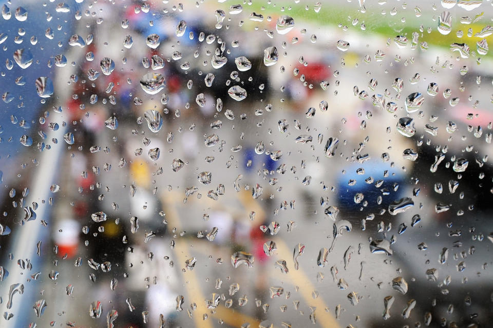 BROOKLYN, MI - JUNE 17: A general view of pit road through a window as rain falls before the NASCAR Sprint Cup Series Quicken Loans 400 at Michigan International Speedway on June 17, 2012 in Brooklyn, Michigan. (Photo by Drew Hallowell/Getty Images for NASCAR)