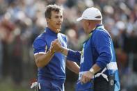 Golf - 2018 Ryder Cup at Le Golf National - Guyancourt, France - September 30, 2018 - Team Europe's Thorbjorn Olesen shakes hands with his caddy during the Singles REUTERS/Paul Childs