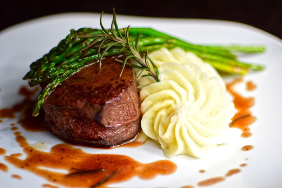 steak, potatoes, and asparagus on plate