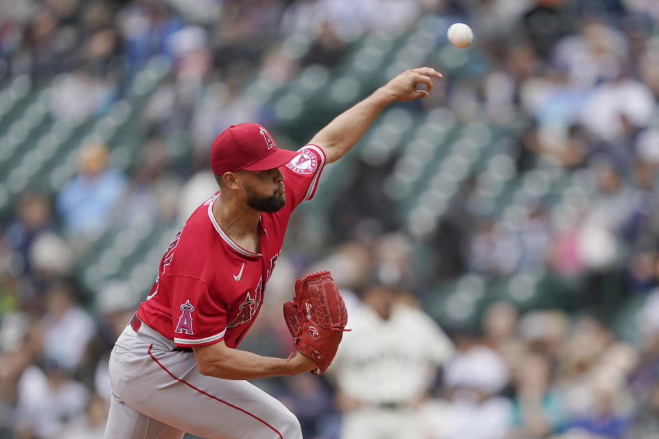 Los Angeles Angels starting pitcher Patrick Sandoval throws against the Seattle Mariners during the first inning of the first baseball game of a doubleheader, Saturday, June 18, 2022, in Seattle. (AP Photo/Ted S. Warren)