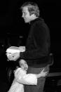 <p>Clinging to her dad, Jon Voight, in 1980.</p>