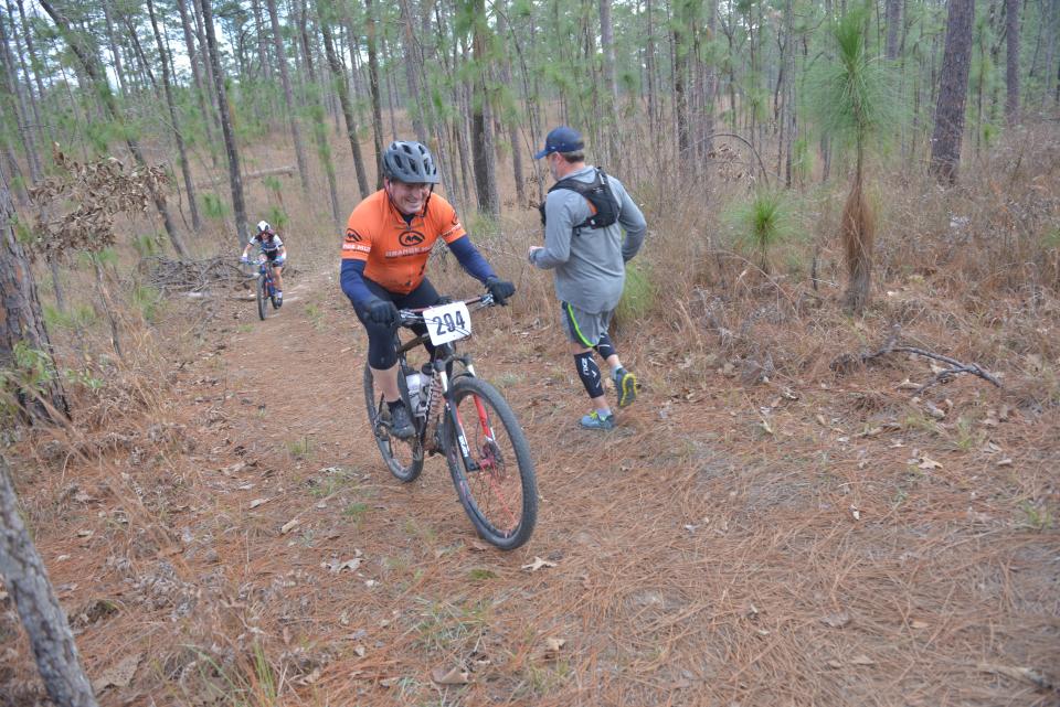 Runners and cyclists compete in the Wild Azalea Trall Challenge in 2022. Jonas Crews of Heartland Forward believes Central Louisiana has tremendous natural resources like the forest, trails, lakes and waterways to tap into to get the ball rolling on developing an outdoor recreation economy. The Wild Azalea Trail is 26 miles long and is the longest continuous trail in Louisiana.