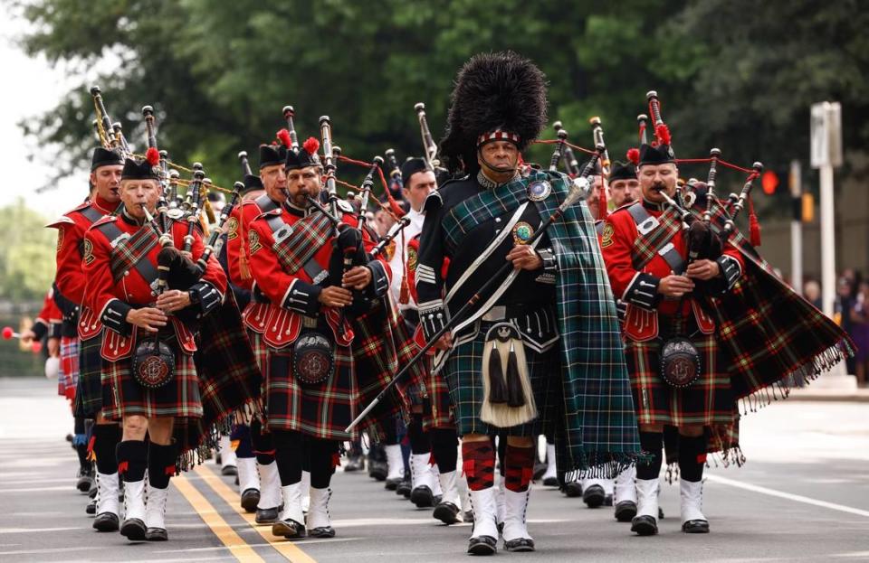 Pipers lead the processional of officer Joshua Eyer outside CMPD headquarters to First Baptist Church on Friday, May3, 2024. Officer Eyer was killed while serving a warrant in east Charlotte on Monday, April 29, 2024