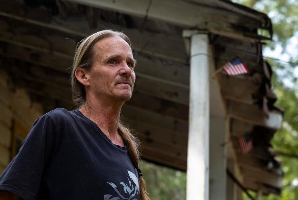 Fred Boyum stands outside of his home at the entrance of Sam Houston Lake Estates on August 22, 2023.       