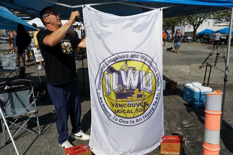 Union members with the International Longshore and Warehouse Union Canada (ILWU) gather, in Vancouver