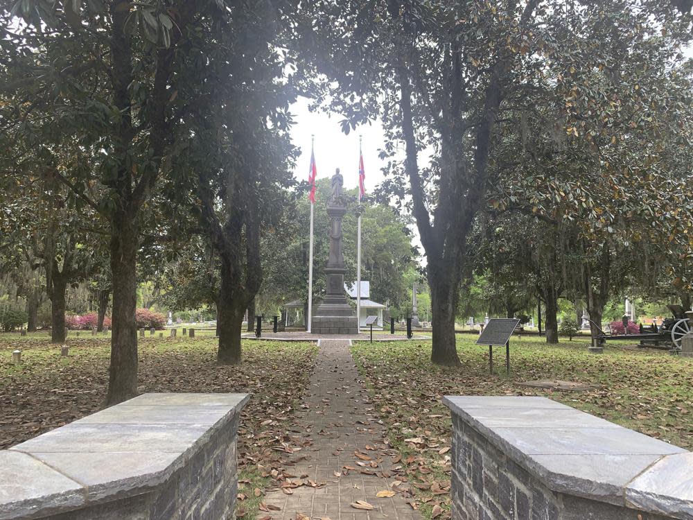 A chair carved out of limestone honoring confederate President Jefferson Davis was stolen from confederate Memorial Circle, a private section of Live Oak Cemetery, Tuesday, April 13, 2020, in Selma, Ala. (Kim Chandler/Associated Press)