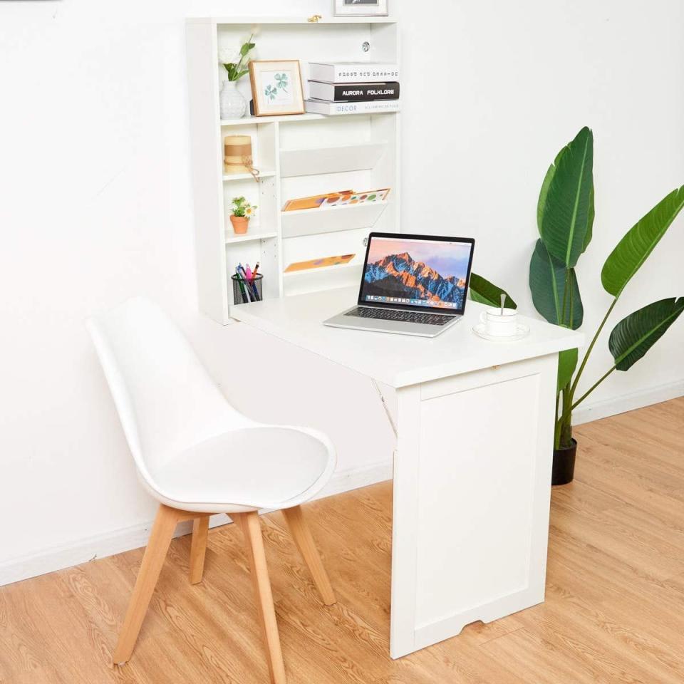 <p>How cool is this <span>Tangkula Wall Mounted Table</span> ($95)? The desk has a foldable design that takes up almost no space at all. Its adjustable storage shelves come in handy for tucking away books and other office trinkets. Pick it up in black or white.</p>
