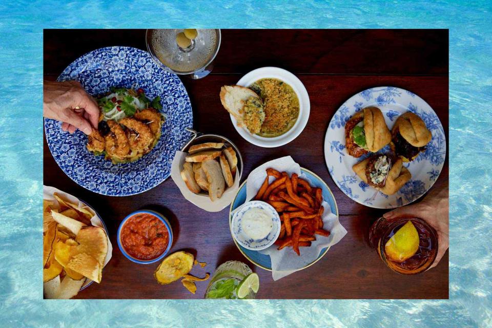 <p>Ellen Silverman/Courtesy of Summerhouse. Background: Getty Images</p> Caribbean bar snacks at Summerhouse, a restaurant in Ocho Rios, Jamaica, from Suzanne and Michelle Rousseau.
