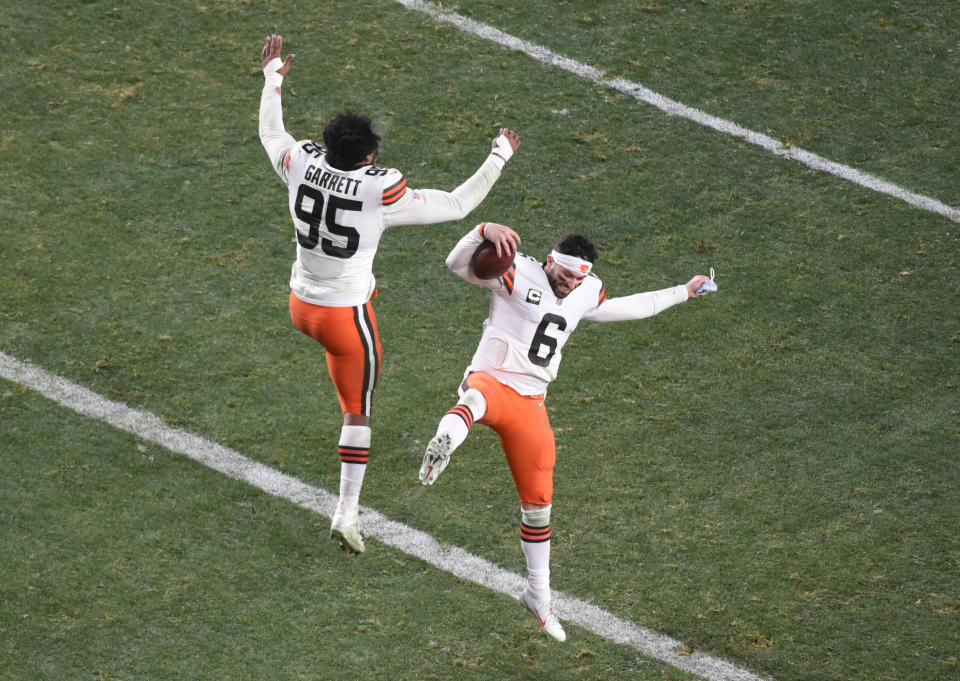 Browns quarterback Baker Mayfield (6) and defensive end Myles Garrett (95) celebrate after their win over the Steelers in the AFC Wild Card playoff game, Jan. 10, 2021, in Pittsburgh. (Philip G. Pavely-USA TODAY Sports)