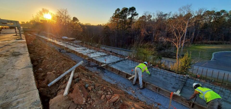 GDOT crews work on the retaining wall at the I-20 bridge project at the Georgia-South Carolina state line. Project completion, originally scheduled for this year, is expected now for spring 2023.