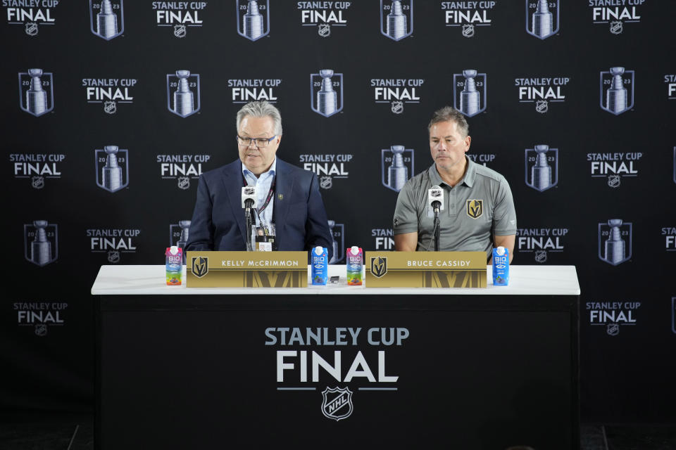 Vegas Golden Knights general manager Kelly McCrimmon, left, and head coach Bruce Cassidy speak during a news conference ahead of the NHL Stanley Cup hockey final Friday, June 2, 2023, in Las Vegas. (AP Photo/John Locher)
