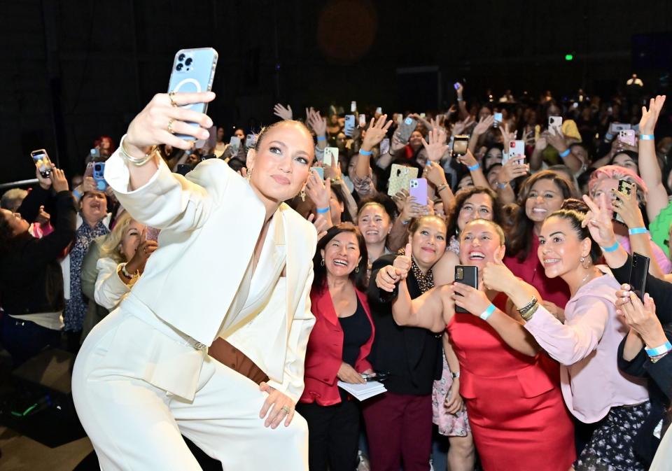 UNIVERSAL CITY, CALIFORNIA - SEPTEMBER 17: Jennifer Lopez takes a selfie with the audience as Jennifer Lopez joins Grameen America's “Raising Latina Voices” to kick-off Hispanic Heritage Month presented by Bank of The West with support from Meta at Universal Studios Backlot on September 17, 2022 in Universal City, California. (Photo by Stefanie Keenan/Getty Images for Limitless Labs x Grameen)