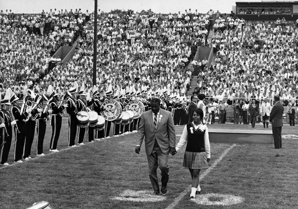 Pro Football Hall of Fame Class of 1968 inductee Marion Motley walks on the field at Fawcett Stadium in Canton for the coin toss before the Hall of Fame Game.