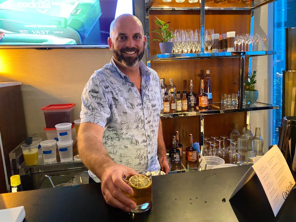 Ryan Goodman of Wander Folk Spirits shows off a completed Fhloston Paradise cocktail at Vast in Oklahoma City.